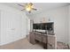 Bright home office featuring a wood desk, neutral walls, and plenty of closet space at 512 Red Oak Ct, Tega Cay, SC 29708