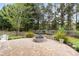 Outdoor stone patio featuring a fire pit and a well-manicured lawn at 512 Red Oak Ct, Tega Cay, SC 29708