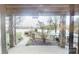 Outdoor back porch looking out to the lake, swimming pool, and a meticulously landscaped yard at 7424 Windy Pine Cir, Denver, NC 28037