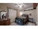 Comfortable bedroom featuring decorative accents, a plush bed, and ample closet space at 7424 Windy Pine Cir, Denver, NC 28037
