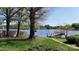 Serene lake view from the lush, landscaped yard, highlighting waterfront living at 7424 Windy Pine Cir, Denver, NC 28037