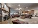 Spacious open living area with stone fireplace, plush seating, and seamless transition to the kitchen at 7424 Windy Pine Cir, Denver, NC 28037