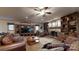 Warm and inviting living room with stone fireplace, built-in shelving, and cozy seating for relaxing at 7424 Windy Pine Cir, Denver, NC 28037