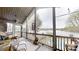 Spacious porch with wicker furniture, a ceiling fan, and a view of the lake and pool at 7424 Windy Pine Cir, Denver, NC 28037