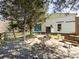 Backyard with wooden deck, featuring outdoor seating, landscaping, and access to the water at 7545 Brancy St, Kannapolis, NC 28081