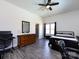Comfortable bedroom with a dresser, decorative mirror, ceiling fan, and natural light at 7545 Brancy St, Kannapolis, NC 28081