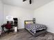 Cozy bedroom with a modern desk setup, comfortable bed, and neutral decor creating a serene space at 7545 Brancy St, Kannapolis, NC 28081