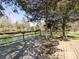Wooden deck overlooking scenic lake views with outdoor seating for relaxation and enjoying the scenery at 7545 Brancy St, Kannapolis, NC 28081