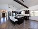 Beautiful kitchen featuring a vaulted ceiling, dark cabinets, granite countertops, and a large kitchen island at 7545 Brancy St, Kannapolis, NC 28081