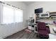 Bright office space with a large window, functional desk, and a cozy cat tree for added charm at 7545 Brancy St, Kannapolis, NC 28081