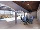 Covered patio with stylish seating area overlooking an indoor pool and scenic outdoor views at 7545 Brancy St, Kannapolis, NC 28081