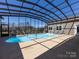 Indoor pool featuring a screened enclosure offering beautiful outdoor views and ample natural light at 7545 Brancy St, Kannapolis, NC 28081