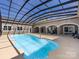 Indoor pool features an expansive screened enclosure with outdoor views and ample space for lounging at 7545 Brancy St, Kannapolis, NC 28081