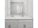 Modern bathroom featuring double sinks and a sleek mirror at 7730 Woolsey Dr, Gastonia, NC 28056