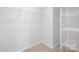 Spacious walk-in closet with ample shelving for storage and organization at 7730 Woolsey Dr, Gastonia, NC 28056