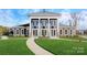 Attractive clubhouse exterior with columns, manicured lawn, and inviting entrance at 7730 Woolsey Dr, Gastonia, NC 28056