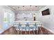 A stylish kitchen boasts pendant lighting, a breakfast bar with seating, and stainless steel appliances at 7730 Woolsey Dr, Gastonia, NC 28056
