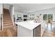 Open-concept kitchen with stainless steel appliances and stairs leading to the second floor at 7730 Woolsey Dr, Gastonia, NC 28056