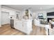 Open-concept kitchen featuring a large island and a view of the living room at 7730 Woolsey Dr, Gastonia, NC 28056