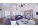 Spacious living room showcasing high ceilings, a modern kitchen, and comfortable seating at 7730 Woolsey Dr, Gastonia, NC 28056