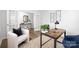 Stylish home office with a modern desk, accent chair, and French doors at 7730 Woolsey Dr, Gastonia, NC 28056