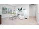Comfortable sitting area features cozy armchairs and calming natural light creating the perfect relaxation nook at 7730 Woolsey Dr, Gastonia, NC 28056