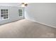 Large bedroom with neutral carpet floors and two large windows at 78162 Rillstone Dr, Lancaster, SC 29720