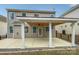 Covered back patio featuring fan and iron fence at 78162 Rillstone Dr, Lancaster, SC 29720