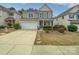 Charming two-story home with a well-manicured lawn, attached garage, and welcoming front porch at 78162 Rillstone Dr, Lancaster, SC 29720