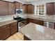 Well-equipped kitchen with stainless steel appliances and granite countertops at 78162 Rillstone Dr, Lancaster, SC 29720