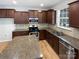 Modern kitchen with stainless steel appliances, granite countertops, and ample cabinet space at 78162 Rillstone Dr, Lancaster, SC 29720