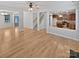 Open living space with wood floors that leads to the kitchen and staircase at 78162 Rillstone Dr, Lancaster, SC 29720