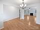Spacious living room with wood floors, decorative chandelier, and fireplace at 78162 Rillstone Dr, Lancaster, SC 29720
