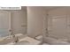 Bathroom with shower and bath combination, a single sink and white cabinets at 8067 Kennesaw Dr, Gastonia, NC 28056