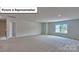 Large bedroom featuring neutral walls, carpet, recessed lighting and a bright sunny window at 8067 Kennesaw Dr, Gastonia, NC 28056