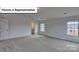 Spacious bedroom featuring vaulted ceiling, neutral walls, carpet, and a door to the bathroom at 8067 Kennesaw Dr, Gastonia, NC 28056