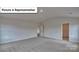 Bright and airy bedroom showcasing neutral walls and plush carpeting at 8067 Kennesaw Dr, Gastonia, NC 28056
