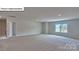 Large bedroom featuring neutral walls, carpet, recessed lighting and a bright sunny window at 8067 Kennesaw Dr, Gastonia, NC 28056