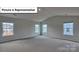 Large bedroom featuring neutral walls, carpet, and three windows allowing for plenty of sunlight at 8067 Kennesaw Dr, Gastonia, NC 28056
