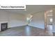 Open-concept living room with fireplace, laminate wood flooring and staircase at 8067 Kennesaw Dr, Gastonia, NC 28056