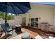 Cozy back patio features a fire pit, grill, outdoor seating, and sliding glass doors to the home at 969 Copperstone Ln, Fort Mill, SC 29708