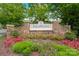 Stone community entrance sign surrounded by vibrant landscaping and lush green trees at 969 Copperstone Ln, Fort Mill, SC 29708