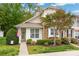 Charming home featuring stone accents, a manicured lawn, and a welcoming front entrance at 969 Copperstone Ln, Fort Mill, SC 29708