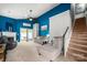 Bright living room featuring a fireplace, ceiling fan, cozy couches, and a staircase at 969 Copperstone Ln, Fort Mill, SC 29708