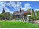 Expansive backyard featuring a stone patio, lush lawn, and a pristine pool with statue accents at 1012 Clover Crest Ln, Weddington, NC 28104