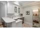 Elegant bar area with marble countertops, custom cabinets, and wine storage at 1012 Clover Crest Ln, Weddington, NC 28104