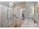 Luxurious bathroom with a glass-enclosed shower, marble countertops, and stylish fixtures at 1012 Clover Crest Ln, Weddington, NC 28104