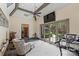 Bright bonus room with neutral walls, ceiling fan, and doors to the back patio overlooking a yard at 1012 Clover Crest Ln, Weddington, NC 28104
