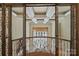 Stunning foyer with wrought iron railings, coffered ceilings, and an open view to the outdoors at 1012 Clover Crest Ln, Weddington, NC 28104