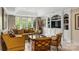 Comfortable living room with large windows, built-in shelves, and tasteful decor at 1012 Clover Crest Ln, Weddington, NC 28104